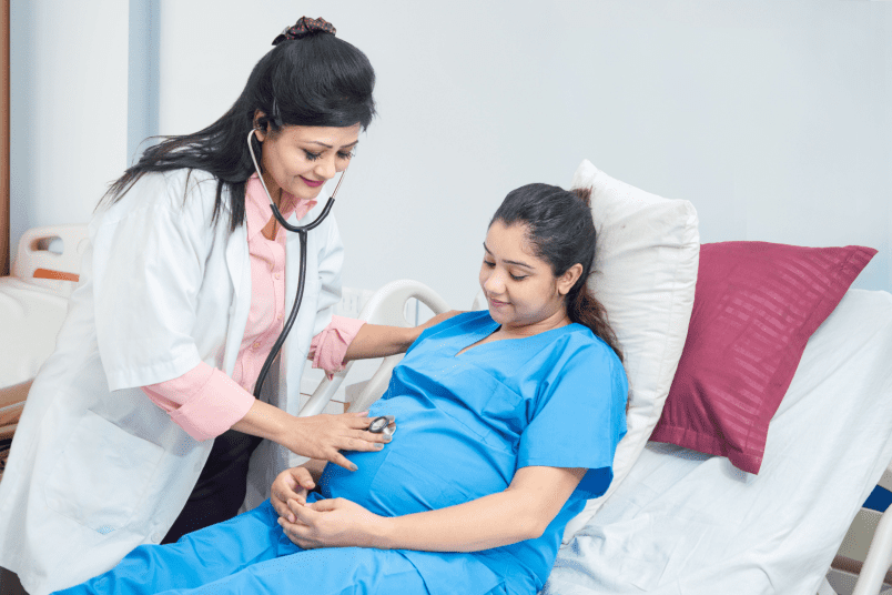 Doctor Examining Pregnant Woman - NU Fertility