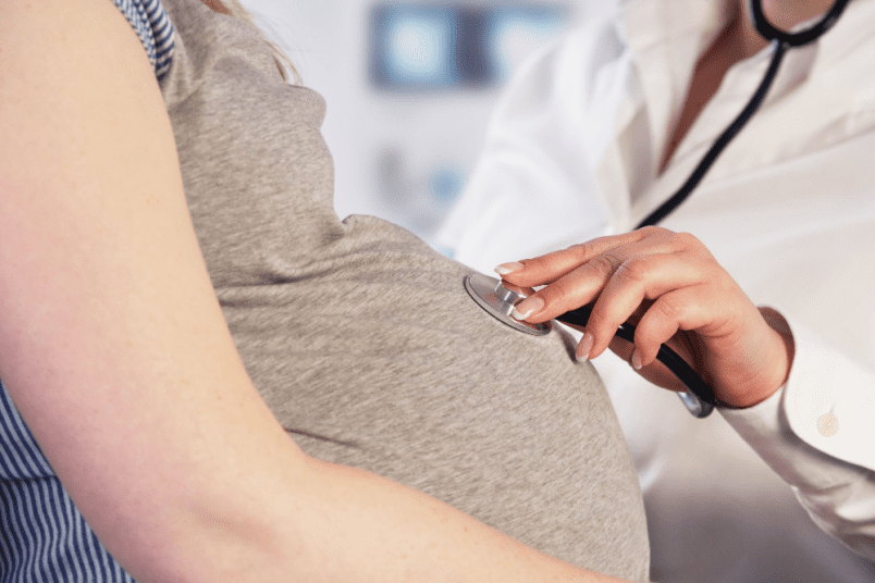 Doctor Examining Pregnant Woman - NU Fertility